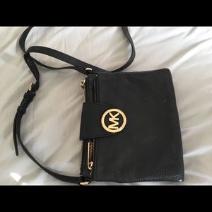 Two over the shoulder Michael Kors purses,